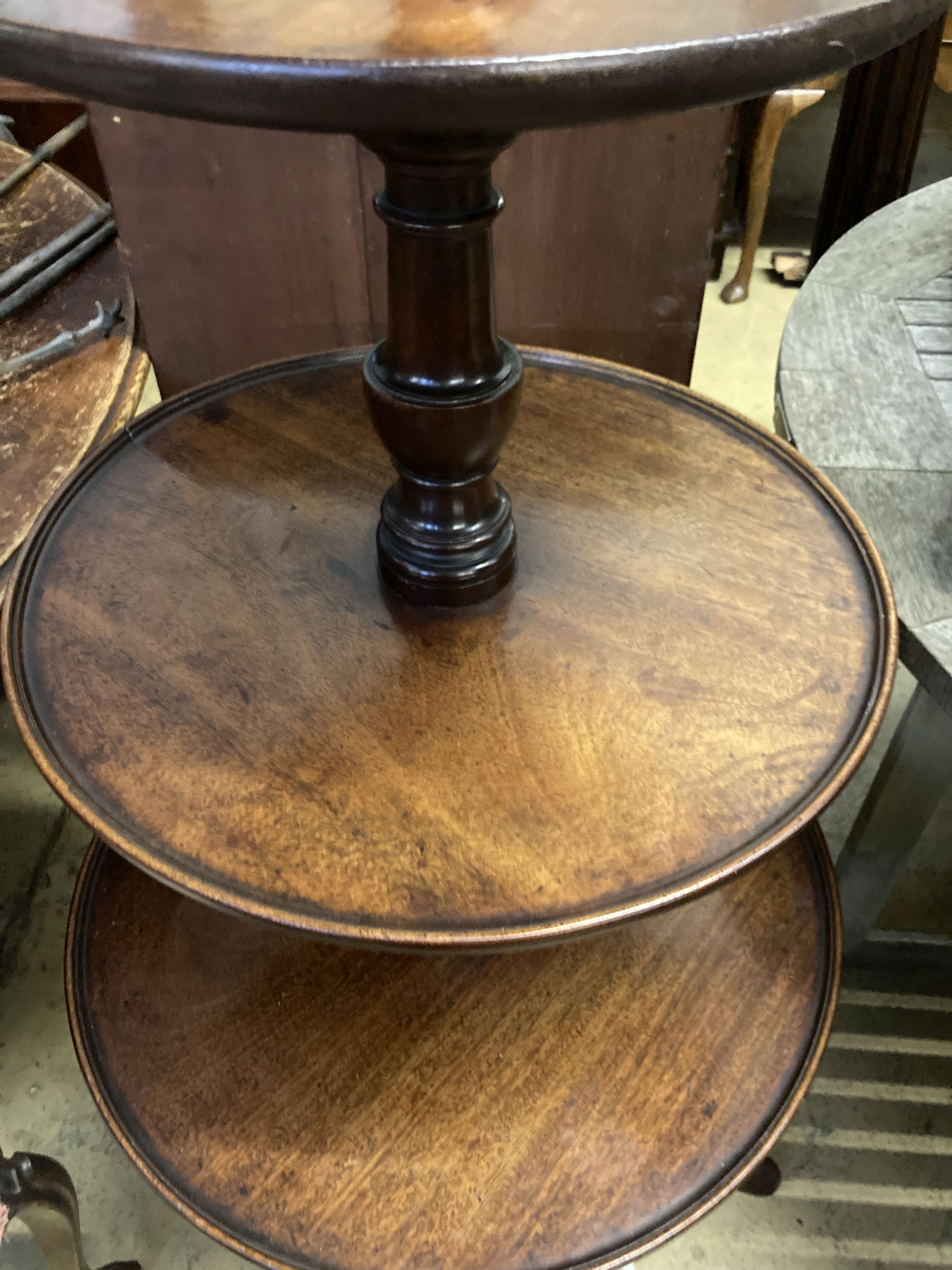 A George III mahogany three tier dumb waiter, converted to a lamp, height 115cm